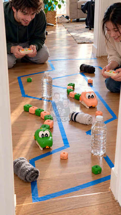 Two players steering remote control magnetic snakes through a blue tape race track with water bottles and socks in a hallway — 7