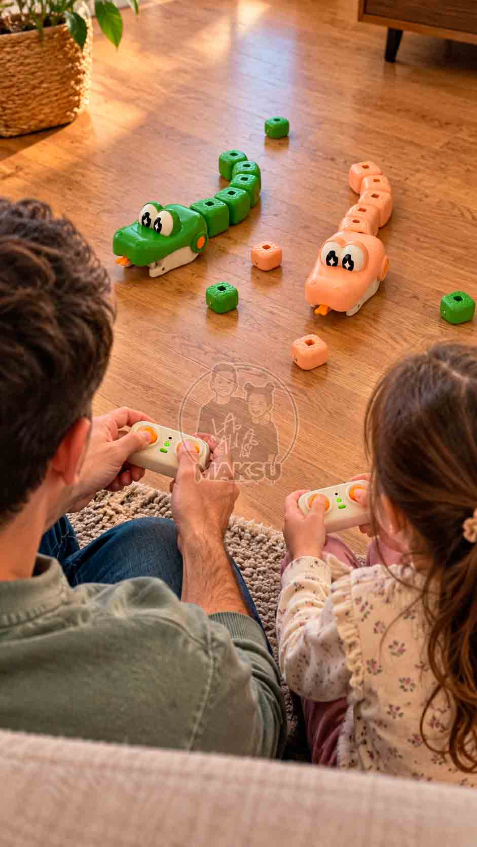 Dad and daughter on the living room floor driving green and cream remote control snakes