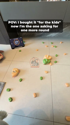 Kids racing two RC magnetic snakes on the floor — 3