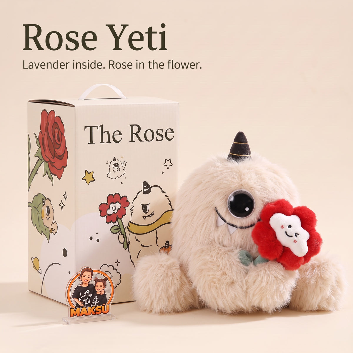Rose Yeti يحمل وردة معطرة من القماش بجانب علبة الهدية