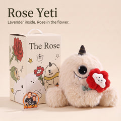 Rose Yeti يحمل وردة معطرة من القماش بجانب علبة الهدية — 14